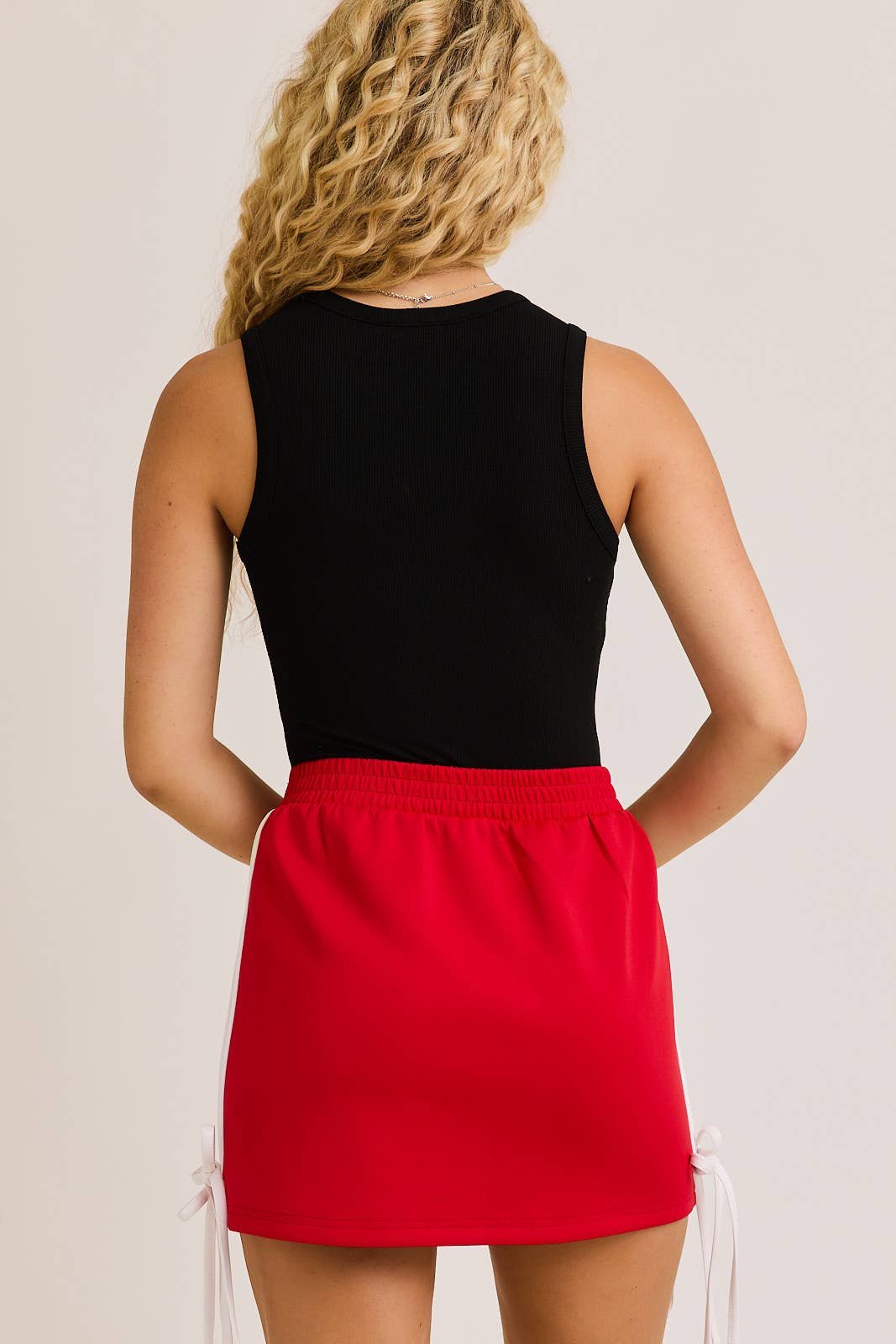 Race Royalty™ Round Neck Sleeveless Bodysuit in Black — fitted sleeveless bodysuit with round neckline, part of The Queens Closet.