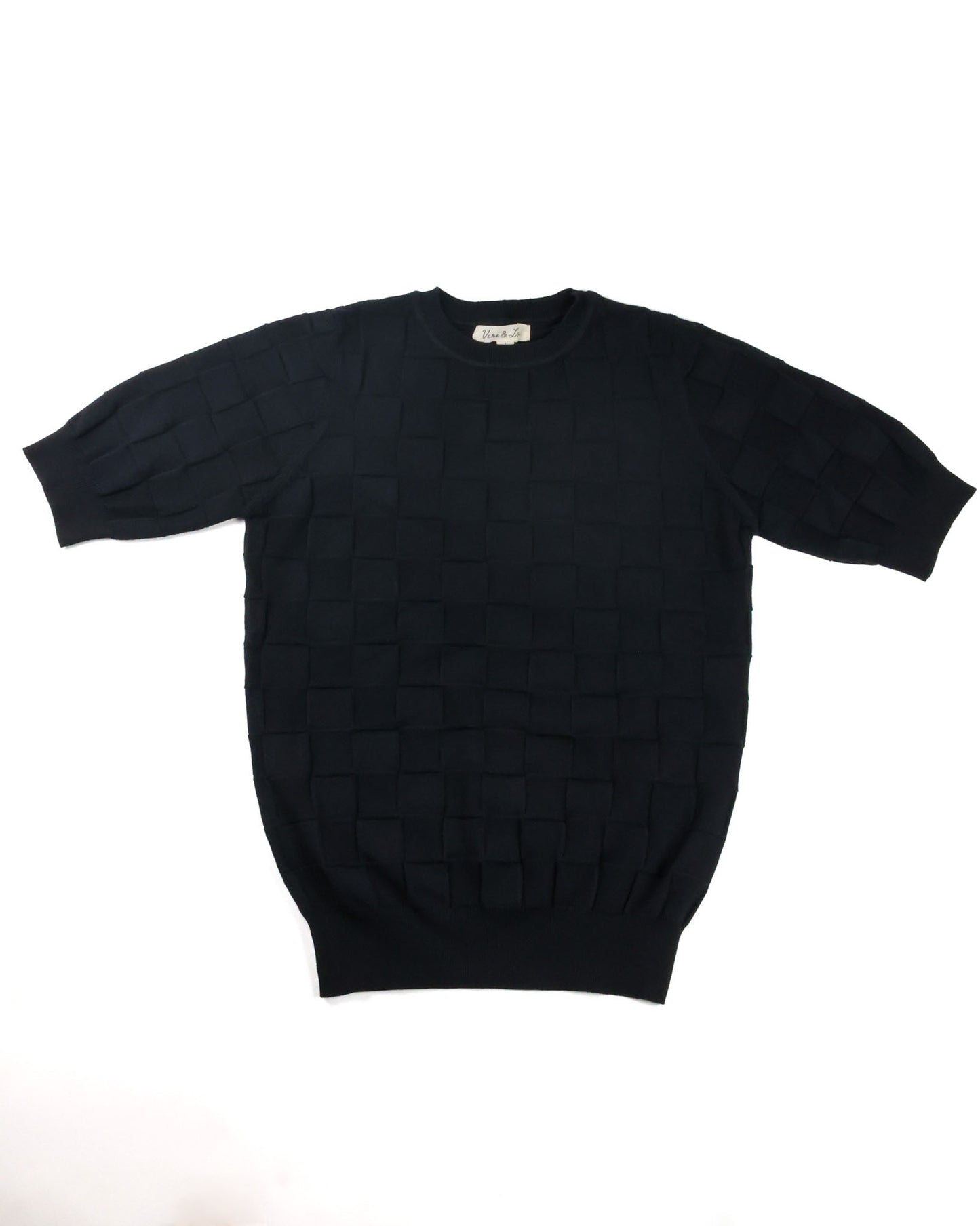 A black short-sleeve knit sweater with a textured basketweave pattern, laid flat against a white background.
