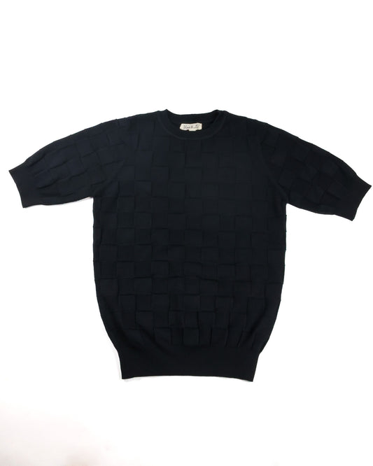 A black short-sleeve knit sweater with a textured basketweave pattern, laid flat against a white background.