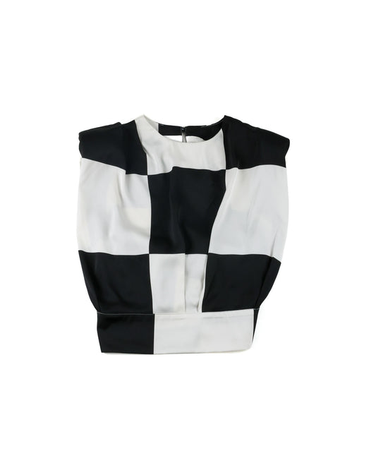 A black and white checkered cropped top with a crew neck, displayed flat against a plain white background.