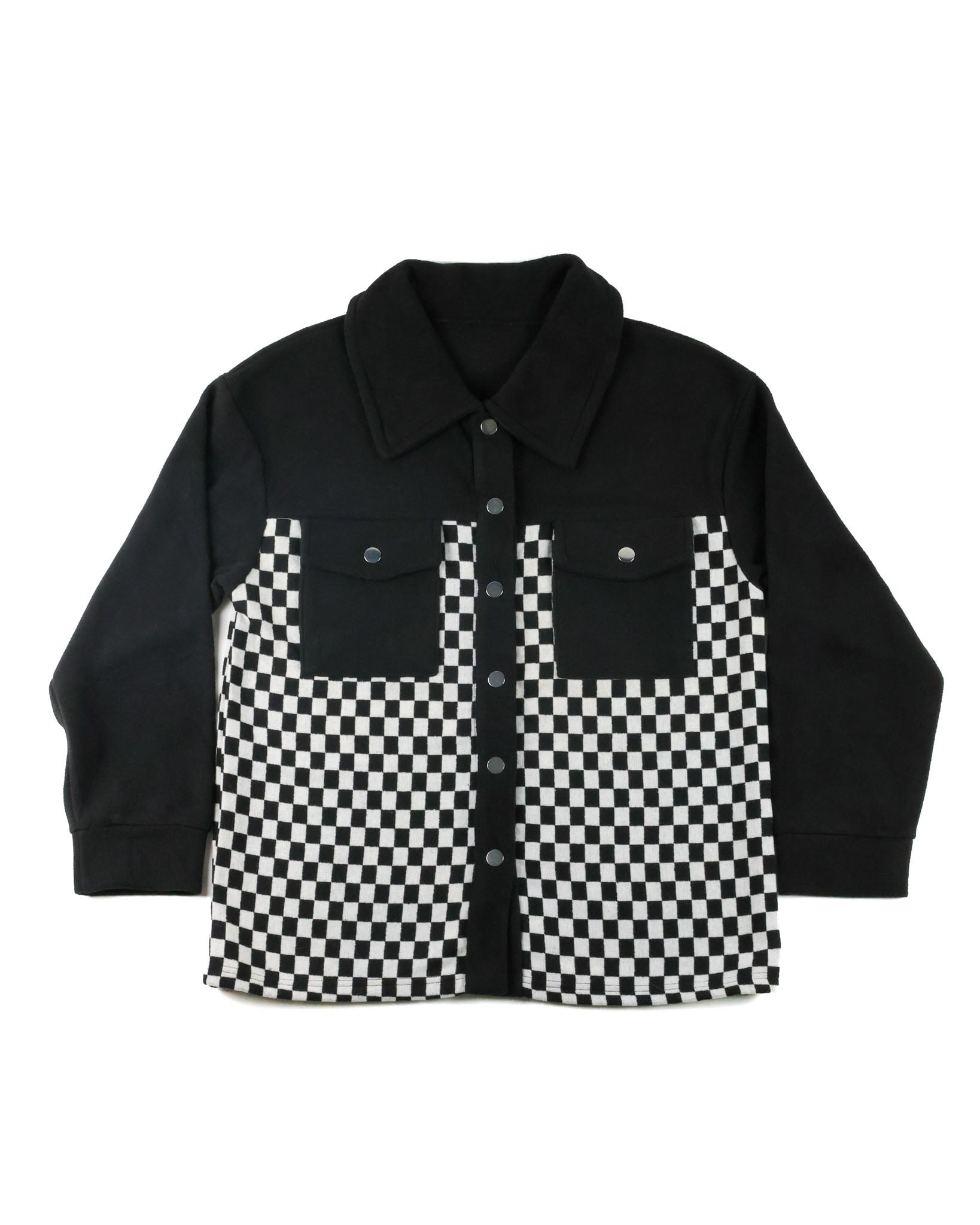A black long-sleeve button-up shirt jacket with a black and white checkerboard pattern on the front chest and lower hem, displayed flat against a white background.