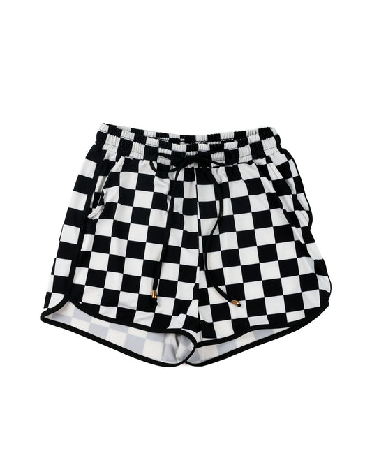 Black and white checkered shorts with an elastic drawstring waist, displayed against a solid white background.