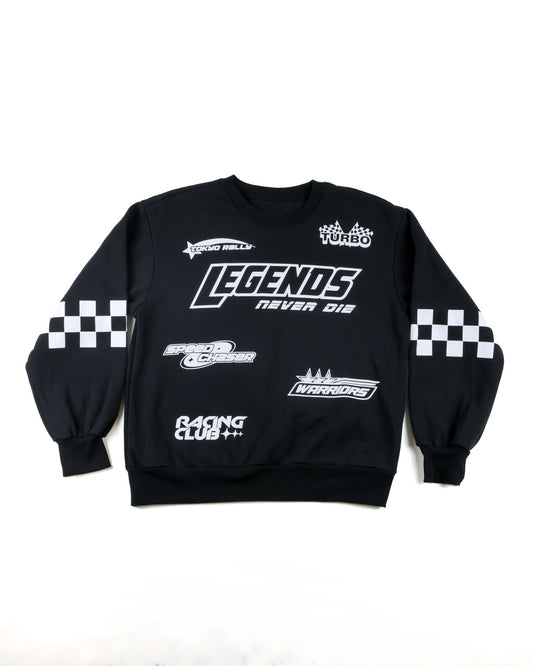 A black long-sleeve crewneck sweatshirt with various white racing-themed graphics, including 'LEGENDS NEVER DIE' on the chest, checkered patterns on the sleeves, and sponsor-style logos.