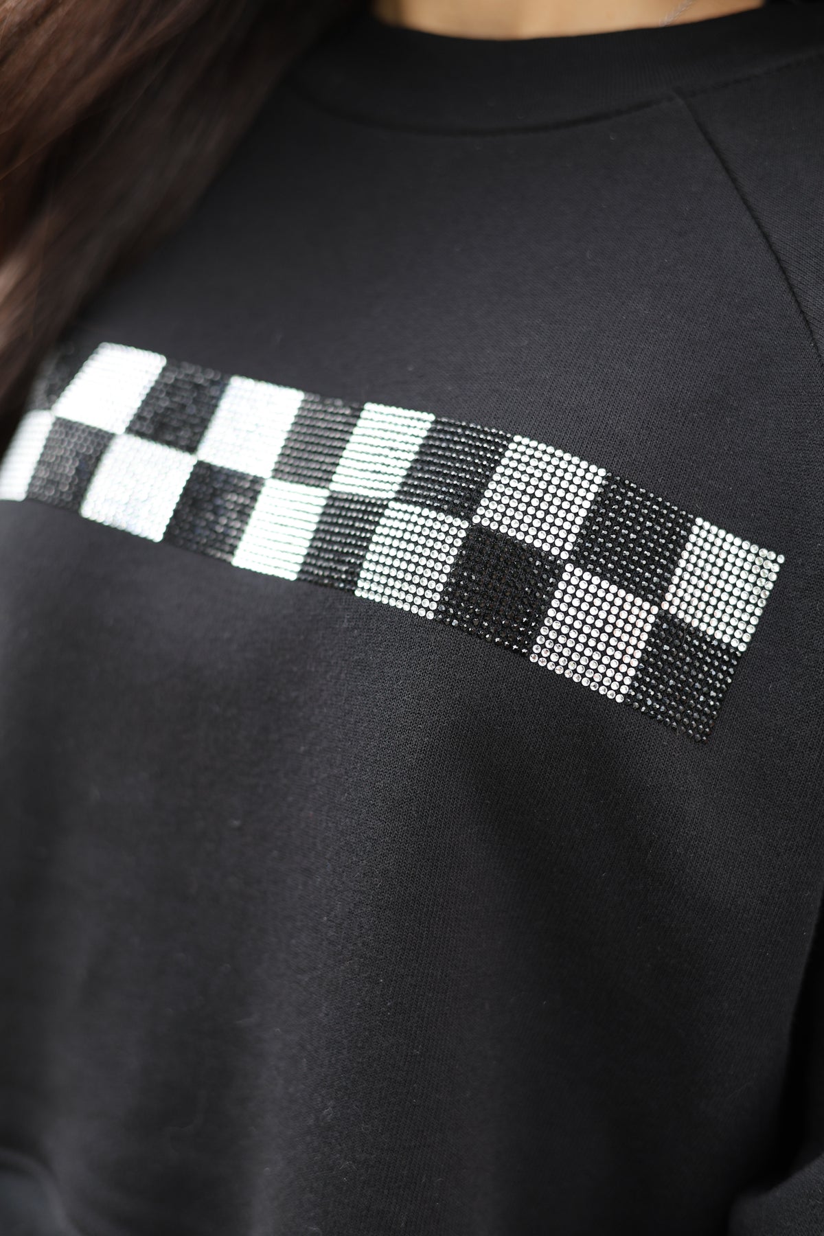 Race Royalty checkered crewneck, rhinestone design close-up