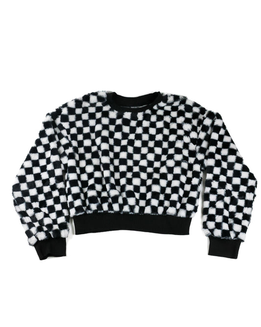 A cropped long-sleeve sweatshirt with a black and white checkered fuzzy pattern, featuring solid black ribbed cuffs, collar, and hem, displayed on a plain white background.