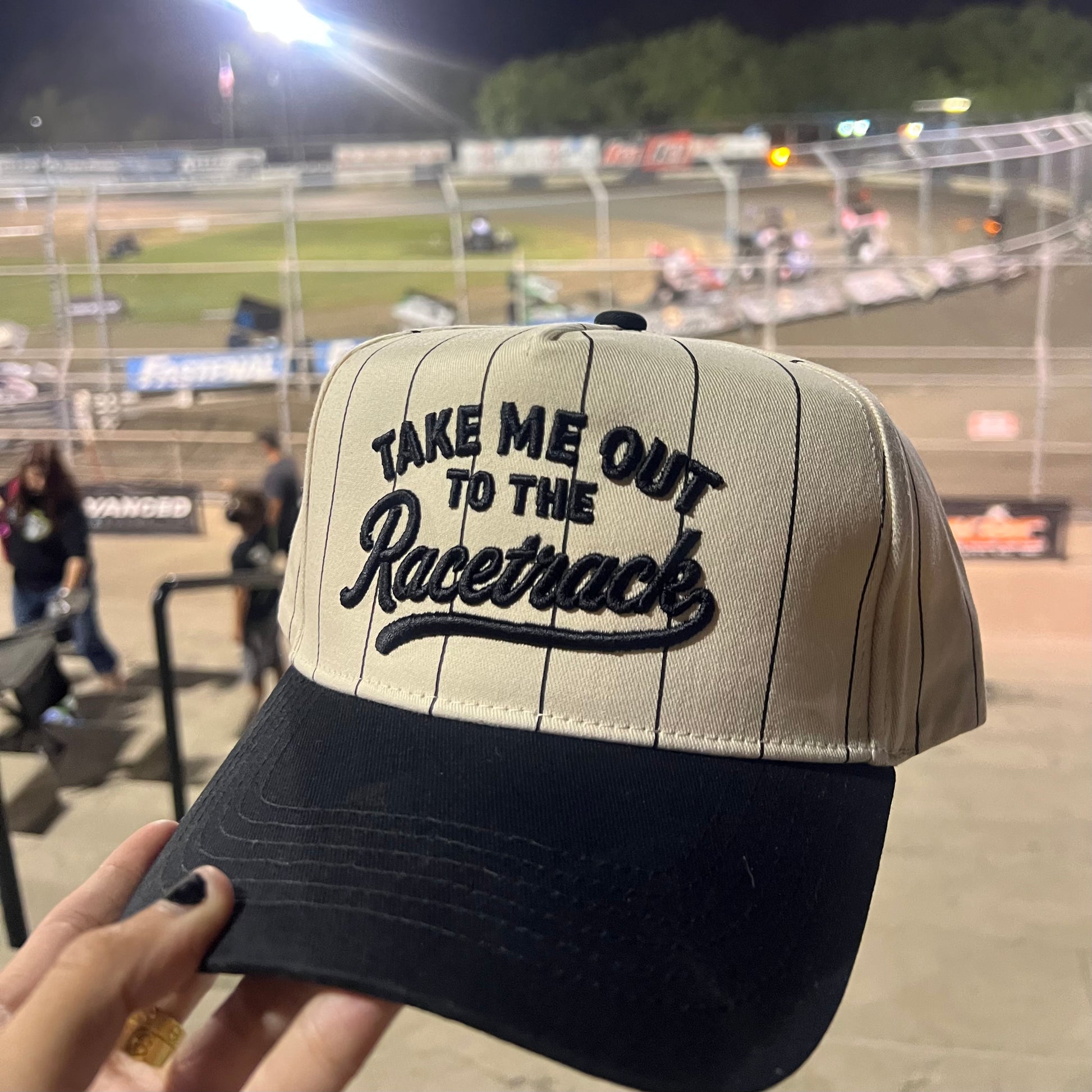 Women's motorsport pinstripe hat with matching sweatband and adjustable snap closure.